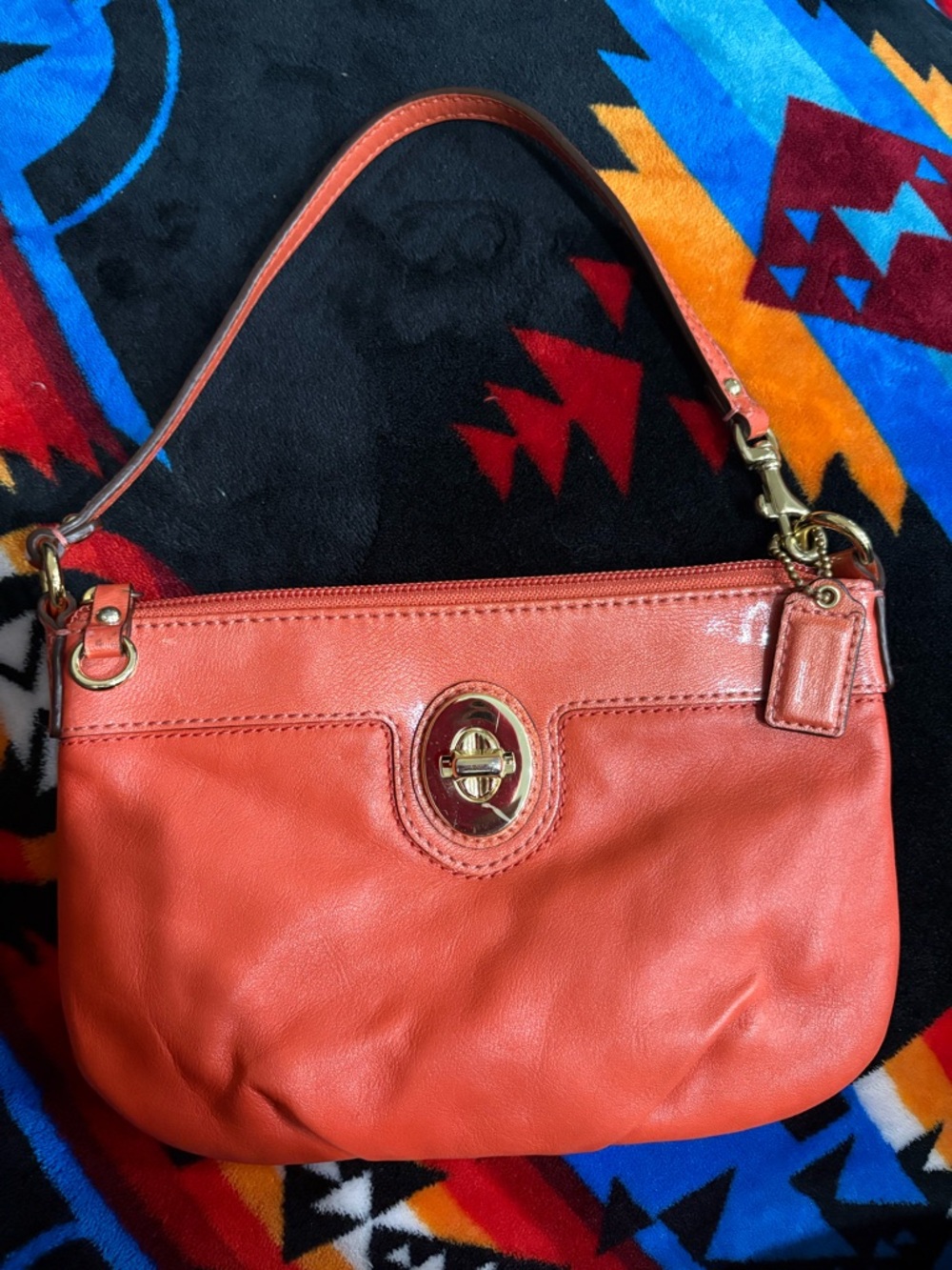 Coach Coral Leather Turn-Lock Wristlet